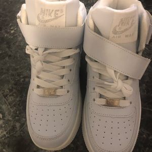 The white Air Force 1 High tops.